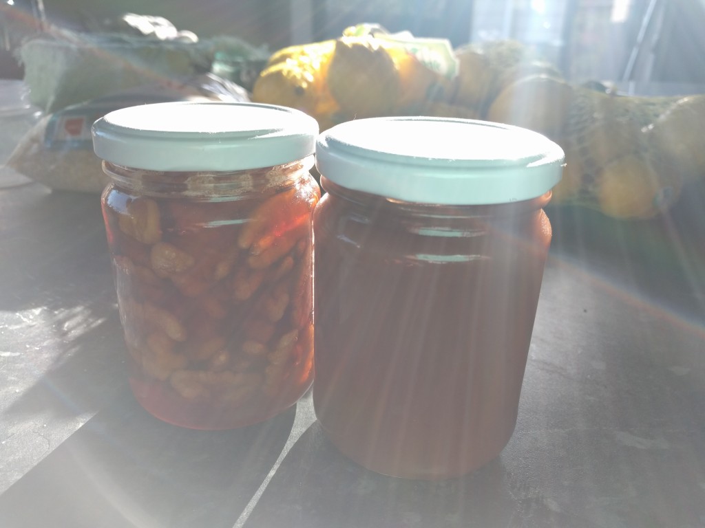 An attempt at an artistic early morning shot of apple butter and walnuts preserved in honey. 